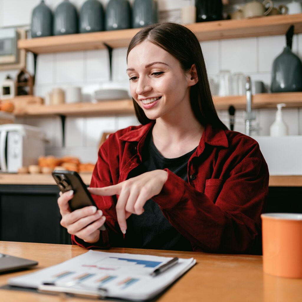 Young businesswoman using smartphone to searching business infor