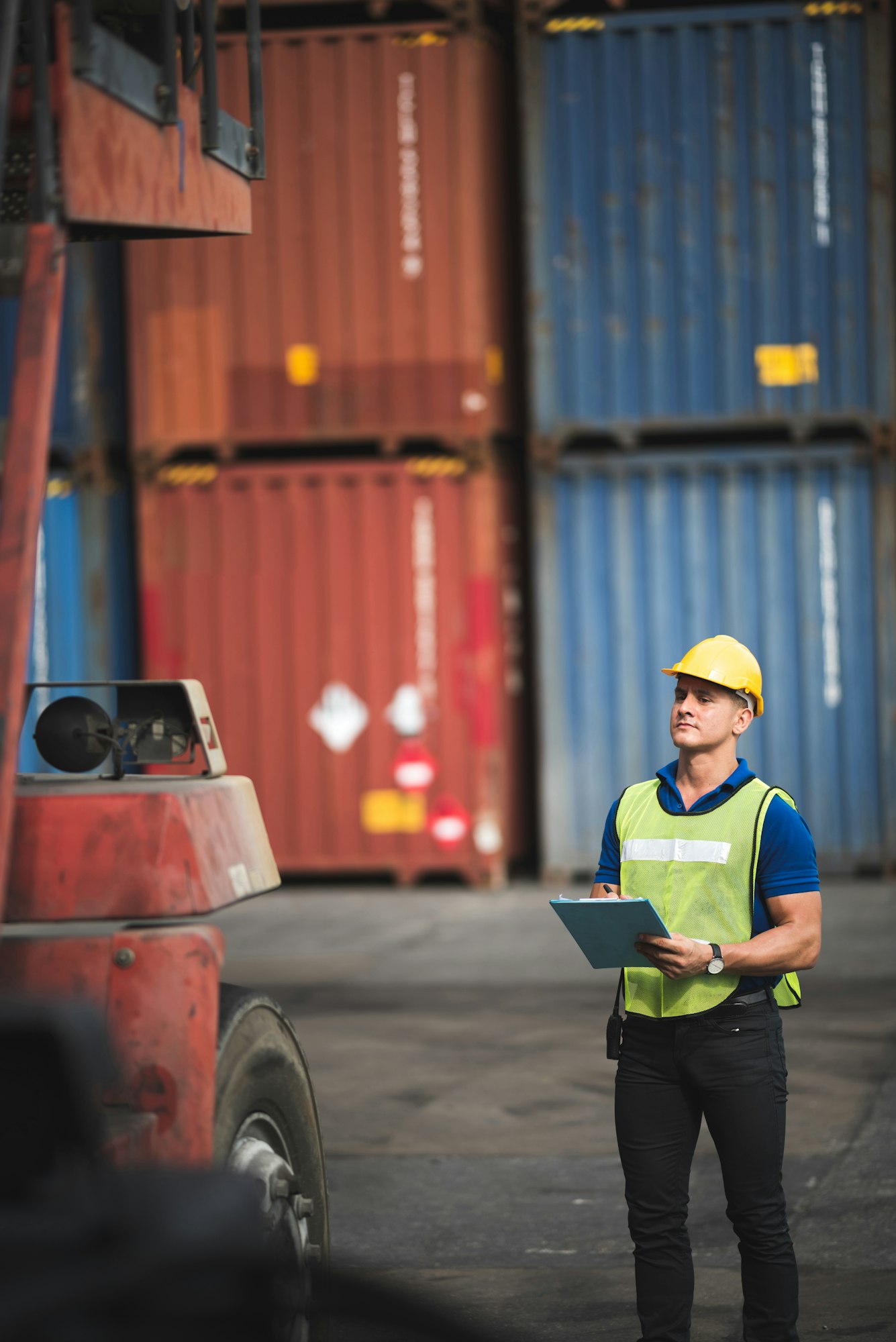 Quality control Inspector checking on container site, logistic store for import and export